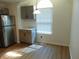 Bright kitchen featuring gray cabinets, stainless steel appliances, and a view of the breakfast nook at 2116 Galaxy Dr, Franklin, IN 46131