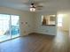 Bright living room with wood floors, a ceiling fan and sliding glass doors leading to the patio at 2116 Galaxy Dr, Franklin, IN 46131