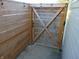 Charming wood-fenced area with string lights and a gate adds privacy to the outdoor space at 2116 Galaxy Dr, Franklin, IN 46131