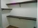 Spacious walk-in closet with wooden shelves, ready for organization and storage at 2116 Galaxy Dr, Franklin, IN 46131