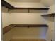 Spacious walk-in closet featuring wooden shelving, offering ample storage solutions at 2116 Galaxy Dr, Franklin, IN 46131