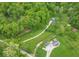 Overhead view of the property and neighborhood with a home, outbuildings, and long driveway at 2935 N Grizzly Ln, Martinsville, IN 46151