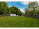 The spacious backyard boasts a storage shed, carport, playset, and a privacy fence at 2935 N Grizzly Ln, Martinsville, IN 46151