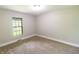 Bedroom featuring neutral carpet, a large window, and freshly painted walls at 2935 N Grizzly Ln, Martinsville, IN 46151