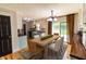 Open concept dining area features stylish furnishings, natural light, and easy access to the kitchen and outdoor patio at 2935 N Grizzly Ln, Martinsville, IN 46151