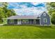 Charming single story home features horizontal siding, front porch, and a well-manicured front lawn at 2935 N Grizzly Ln, Martinsville, IN 46151