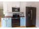 Bright kitchen features wooden countertops, white cabinets, stainless steel appliances, and hardwood floors at 2935 N Grizzly Ln, Martinsville, IN 46151