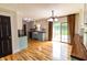 Open-concept kitchen with lots of natural light, hardwood flooring, stainless steel appliances, and wooden countertop at 2935 N Grizzly Ln, Martinsville, IN 46151