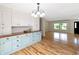 Kitchen includes dining area, a wooden countertop, lots of cabinets, and hardwood flooring at 2935 N Grizzly Ln, Martinsville, IN 46151