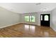 Spacious living room features wood floors, neutral paint, and lots of natural light at 2935 N Grizzly Ln, Martinsville, IN 46151