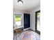 Cozy mudroom features built-in bench, storage lockers, and colorful rug at 2935 N Grizzly Ln, Martinsville, IN 46151