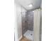 Modern tiled shower with a shower curtain and updated fixtures at 2935 N Grizzly Ln, Martinsville, IN 46151