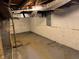 Unfinished basement with concrete walls and exposed ceiling at 322 S Rural St, Indianapolis, IN 46201