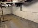 Unfinished basement with concrete walls and exposed ceiling at 322 S Rural St, Indianapolis, IN 46201