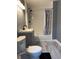 Cozy bathroom with black fixtures and a shower/tub combination with patterned curtain at 322 S Rural St, Indianapolis, IN 46201