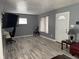 Bright living room with modern gray paint, light-colored floors, and a mounted TV at 322 S Rural St, Indianapolis, IN 46201