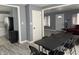 Open-concept living room featuring hardwood floors and neutral paint colors and a connecting kitchen at 322 S Rural St, Indianapolis, IN 46201