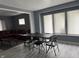 Open-concept living room featuring hardwood floors and neutral paint colors and a large window at 322 S Rural St, Indianapolis, IN 46201