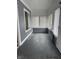 Inviting enclosed porch with abundant natural light, gray paint, and new windows at 322 S Rural St, Indianapolis, IN 46201