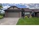Charming single-story home with attached garage, brick accents, and well-maintained lawn at 326 Kilpatrick Ct, Edinburgh, IN 46124