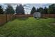 Large fenced backyard with a shed at 3292 Underwood Dr, Whiteland, IN 46184