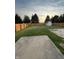This expansive backyard features a shed, green grass, and wooden fence, perfect for outdoor activities at 3292 Underwood Dr, Whiteland, IN 46184