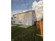 Exterior view of the home's backyard with a patio and fenced yard at 3292 Underwood Dr, Whiteland, IN 46184