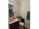 Cozy bathroom features a granite sink and vanity, with neutral paint color at 3292 Underwood Dr, Whiteland, IN 46184