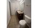 Well-lit bathroom features a spacious vanity, toilet, and neutral tile flooring at 3292 Underwood Dr, Whiteland, IN 46184