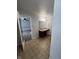 Bathroom featuring a vanity with a countertop, tile flooring, and a door to the bedroom at 3292 Underwood Dr, Whiteland, IN 46184