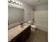 Bright bathroom featuring a shower-tub combo and a traditional vanity with a large mirror at 3292 Underwood Dr, Whiteland, IN 46184