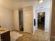 Bathroom featuring vanity and tile flooring with closet entry at 3292 Underwood Dr, Whiteland, IN 46184