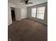 This is a bright bedroom featuring a ceiling fan, a double door closet, and natural light at 3292 Underwood Dr, Whiteland, IN 46184