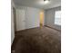 Neutral bedroom with carpeted floors has a closet and a window at 3292 Underwood Dr, Whiteland, IN 46184