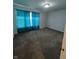 This bedroom has neutral walls, carpeted floors, and windows covered with blue curtains at 3292 Underwood Dr, Whiteland, IN 46184
