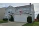 Charming two-story home with gray siding, a two-car garage, and well-maintained landscaping at 3292 Underwood Dr, Whiteland, IN 46184