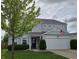 Charming two-story home with gray siding, well-maintained landscaping, and a two-car garage at 3292 Underwood Dr, Whiteland, IN 46184