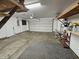 Functional two-car garage with ample storage, shelving, and lighting, providing a practical space for vehicles and projects at 3292 Underwood Dr, Whiteland, IN 46184