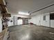 Spacious garage with concrete floor, offering plenty of room for parking and storage, as well as access to the home at 3292 Underwood Dr, Whiteland, IN 46184