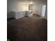 Upstairs hallway offers neutral walls, plush carpet, and access to bedrooms at 3292 Underwood Dr, Whiteland, IN 46184