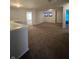 Open hallway with plush carpet leads to bedrooms, offering a comfortable flow throughout the home at 3292 Underwood Dr, Whiteland, IN 46184