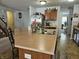 Kitchen with a breakfast bar island, stainless steel appliances, and a view into the living area at 3292 Underwood Dr, Whiteland, IN 46184