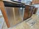 Featuring a stainless steel dishwasher with dark wood cabinets and neutral countertops at 3292 Underwood Dr, Whiteland, IN 46184
