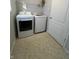 Laundry area featuring washer and dryer units, plus tile floor at 3292 Underwood Dr, Whiteland, IN 46184