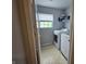 Laundry room featuring a washer, dryer, window and shelving for storage at 3292 Underwood Dr, Whiteland, IN 46184