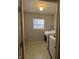 Laundry area featuring washer and dryer units next to a window at 3292 Underwood Dr, Whiteland, IN 46184