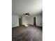 Spacious carpeted living room with a ceiling fan and an open doorway at 3292 Underwood Dr, Whiteland, IN 46184