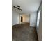 Spacious living area with neutral walls, plush carpeting, and natural light from the window at 3292 Underwood Dr, Whiteland, IN 46184