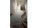 Carpeted staircase with wooden railing and light fixture at 3292 Underwood Dr, Whiteland, IN 46184