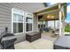 Exterior view of a home showcasing a covered patio, grilling area, and access to the spacious backyard at 3592 Gillsland Rd, Bargersville, IN 46106